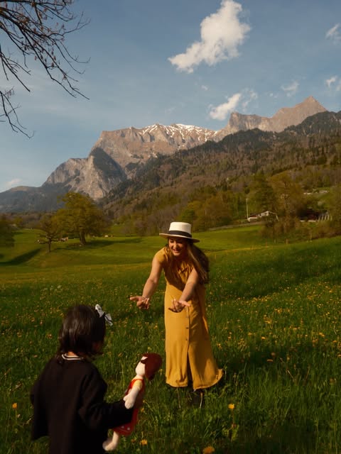 A sunlit proposal in a mountain meadow