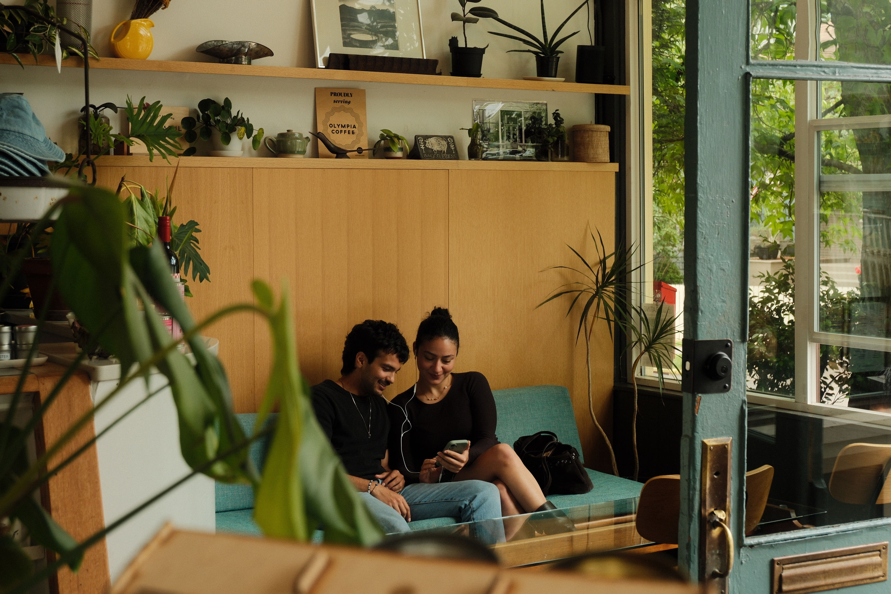 Adi and Defne sharing a quiet moment on a cafe bench