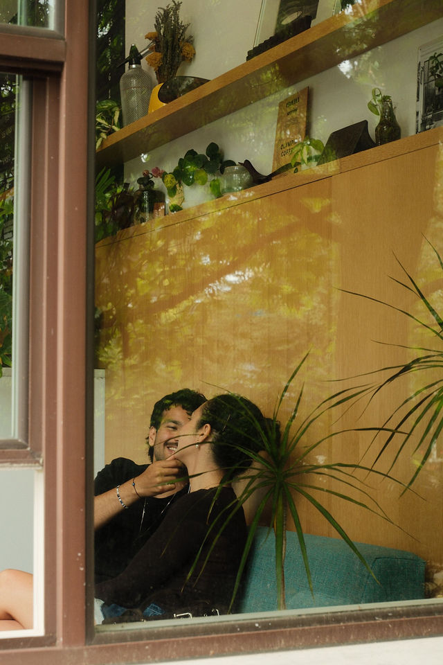 Adi and Defne reflected in a cafe window