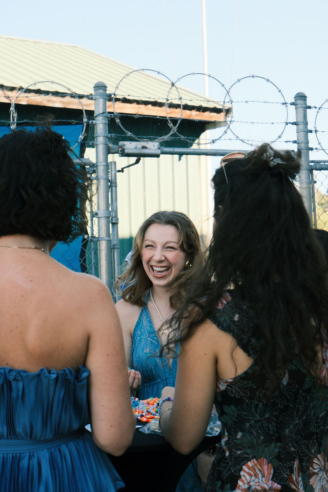 Friends sharing a candid laugh at a summer gathering